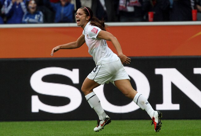 MOENCHENGLADBACH, GERMANY - JULY 13: Alex Morgan of USA celebrates after she scores her team's 3rd goal during the FIFA Women's World Cup 2011 Semi Final match between France and USA at Borussia-Park on July 13, 2011 in Moenchengladbach, Germany. (Photo by Martin Rose/Getty Images)