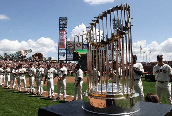 SAN FRANCISCO, CA - APRIL 08:  The 2010 World Series trophy is displayed as San Francisco Giants players line up before the start of the Giants' opening day game against the St. Louis Cardinals at AT&T Park on April 8, 2011 in San Francisco, California.  (Photo by Marcio Jose Sanchez-Pool/Getty Images)