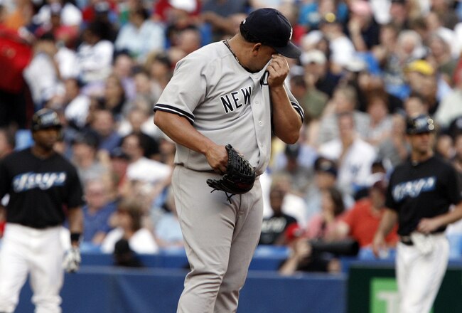 TORONTO, CANADA - JULY 14: Bartolo Colon #40 of the New York Yankees reacts to a 8 run first inning against the Toronto Blue Jays during MLB action at The Rogers Centre July 14, 2011 in Toronto, Ontario, Canada. (Photo by Abelimages/Getty Images)