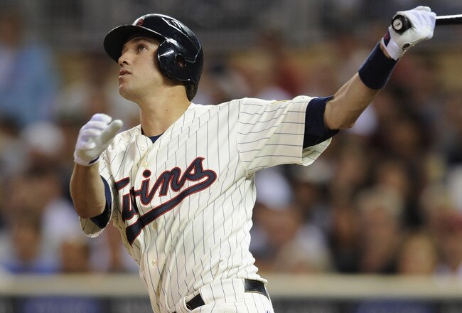 MINNEAPOLIS, MN - JULY 14: Trevor Plouffe #24 of the Minnesota Twins watches after hitting a two-run home run against the Kansas City Royals in the fifth inning on July 14, 2011 at Target Field in Minneapolis, Minnesota. (Photo by Hannah Foslien/Getty Images)