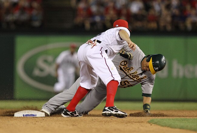 ARLINGTON, TX - JULY 09:  Hideki Matsui #55 of the Oakland Athletics is caught trying to steal second base by Ian Kinsler #5 of the Texas Rangers at Rangers Ballpark in Arlington on July 9, 2011 in Arlington, Texas.  (Photo by Ronald Martinez/Getty Images)