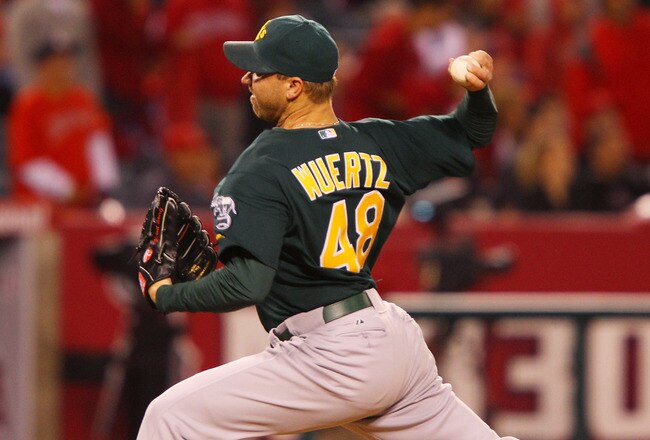 ANAHEIM, CA - MAY 23:  Michael Wuertz #48 of the Oakland Athletics pitches in the eighth inning during the game against the Los Angeles Angels of Anaheim at Angel Stadium on May 23, 2011 in Anaheim, California.  (Photo by Joe Scarnici/Getty Images)