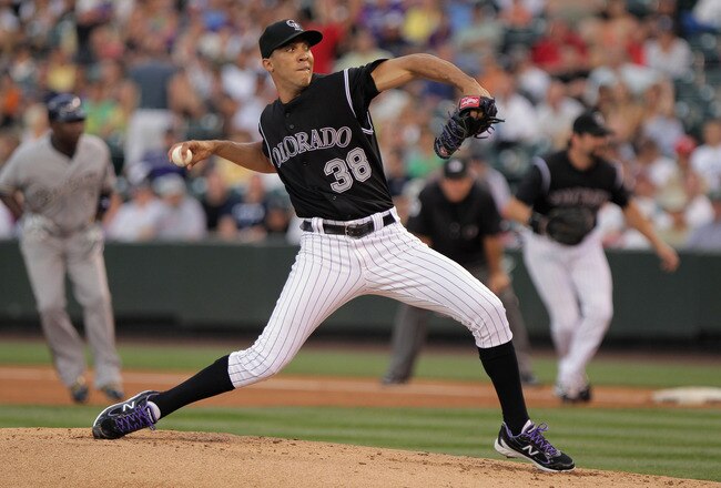 DENVER, CO - JULY 14:  Starting pitcher Ubaldo Jimenez #38 of the Colorado Rockies delviers against the Milwaukee Brewers at Coors Field on July 14, 2011 in Denver, Colorado. Jimenez earned the win as the Rockies defeated the Brewers 12-3.  (Photo by Doug Pensinger/Getty Images)