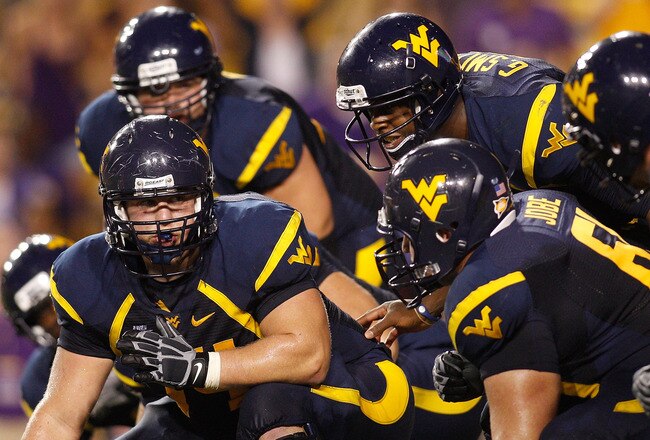 BATON ROUGE, LA - SEPTEMBER 25:  Quarterback Geno Smith #12 of the West Virginia Mountaineers in action against the Louisiana State University Tigers at Tiger Stadium on September 25, 2010 in Baton Rouge, Louisiana.  (Photo by Chris Graythen/Getty Images)