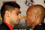LOS ANGELES, CA - JUNE 8:   Amir Khan (L) and Zab Judah face off at a press conference to discuss their upcoming Super Lightweight World Championship Unification Fight at ESPN Zone At L.A. Live on June 8, 2011 in Los Angeles, California. (Photo by Stephen Dunn/Getty Images)