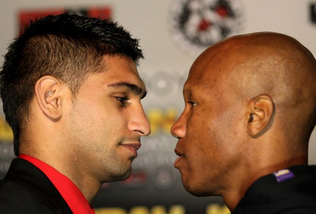 LOS ANGELES, CA - JUNE 8:   Amir Khan (L) and Zab Judah face off at a press conference to discuss their upcoming Super Lightweight World Championship Unification Fight at ESPN Zone At L.A. Live on June 8, 2011 in Los Angeles, California. (Photo by Stephen Dunn/Getty Images)