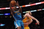 LOS ANGELES, CA - APRIL 26:  Carl Landry #24 of the New Orleans Hornets goes up for a shot against Pau Gasol #16 of the Los Angeles Lakers in the third quarter in Game Five of the Western Conference Quarterfinals in the 2011 NBA Playoffs on April 26, 2011 at Staples Center in Los Angeles, California. NOTE TO USER: User expressly acknowledges and agrees that, by downloading and or using this photograph, User is consenting to the terms and conditions of the Getty Images License Agreement.  (Photo by Harry How/Getty Images)