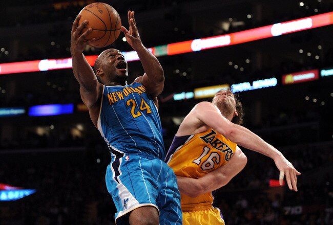 LOS ANGELES, CA - APRIL 26:  Carl Landry #24 of the New Orleans Hornets goes up for a shot against Pau Gasol #16 of the Los Angeles Lakers in the third quarter in Game Five of the Western Conference Quarterfinals in the 2011 NBA Playoffs on April 26, 2011 at Staples Center in Los Angeles, California. NOTE TO USER: User expressly acknowledges and agrees that, by downloading and or using this photograph, User is consenting to the terms and conditions of the Getty Images License Agreement.  (Photo by Harry How/Getty Images)