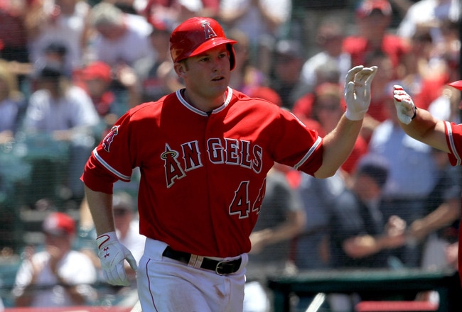 ANAHEIM, CA - JUNE 05:  Mark Trumbo #44 of the Los Angeles Angels of Anaheim is greeted as he returns to the dugout after hitting a home run in the third inning against the New York Yankees on June 5, 2011 at Angel Stadium in Anaheim, California. The Yankees won 5-3.  (Photo by Stephen Dunn/Getty Images)