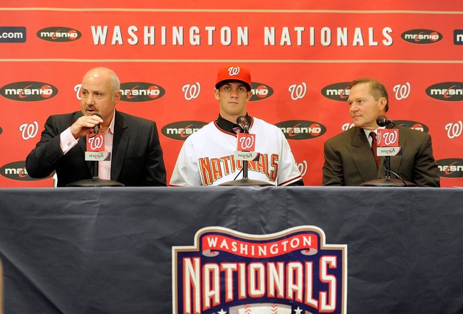 WASHINGTON - AUGUST 26:  General Manger Mike Rizzo, Bryce Harper #34 of the Washington Nationals and Scott Boras talk to the media during a press conference at Nationals Park on August 26, 2010 in Washington, DC.  (Photo by Greg Fiume/Getty Images)