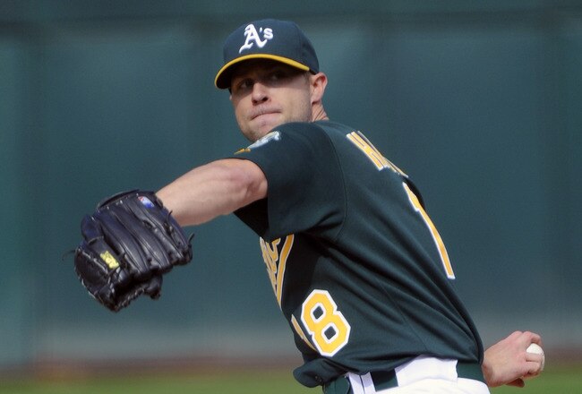 OAKLAND, CA - JULY 16: Rich Harden #18 of the Oakland Athletics pitches against the Los Angeles Angels of Anaheim in the first inning of game two of a double header at the O.co Coliseum July 16, 2011 in Oakland, California. (Photo by Thearon W. Henderson/Getty Images)