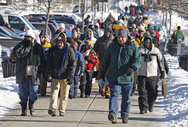 GREEN BAY, WI - FEBRUARY 08:  Packer fans make their way to Lambeau Field for the Green Bay Packers Super Bowl XLV victory ceremony on February 8, 2011 in Green Bay, Wisconsin.  (Photo by Matt Ludtke/Getty Images)