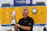 SANDWICH, ENGLAND - JULY 17:  Darren Clarke of Northern Ireland holds the Claret Jug following his victory at the end of the final round of The 140th Open Championship at Royal St George's on July 17, 2011 in Sandwich, England.  (Photo by Ross Kinnaird/Getty Images)