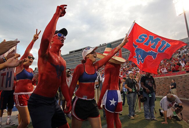 DALLAS - SEPTEMBER 24:  Fans of the SMU Mustangs wave a flag before a game against the TCU Horned Frogs at Gerald J. Ford Stadium on September 24, 2010 in Dallas, Texas.  (Photo by Ronald Martinez/Getty Images)