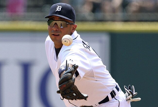 DETROIT - JULY 17: Carlos Guillen #9 of the Detroit Tigers flips the ball over to Jhonny Peralta #27 and turns a double play in the fifth inning of the game against the Chicago White Sox at Comerica Park on July 17, 2011 in Detroit, Michigan. The Tigers defeated the White Soc 4-3. (Photo by Leon Halip/Getty Images)