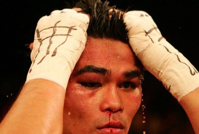 SAN ANTONIO - APRIL 14:  Brian Viloria of the USA reacts after losing to Edgar Sosa of Mexico after their WBC Mini Flyweight Championship on April 14, 2007 at the Alamodome in San Antonio, Texas.  (Photo by Jed Jacobsohn/Getty Images)