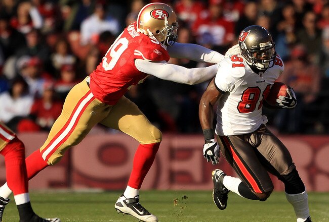 SAN FRANCISCO - NOVEMBER 21:  Micheal Spurlock #81 of the Tampa Bay Buccaneers tries turnover outrun Manny Lawson #99 of the San Francisco 49ers at Candlestick Park on November 21, 2010 in San Francisco, California.  (Photo by Ezra Shaw/Getty Images)