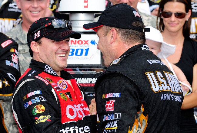 LOUDON, NH - JULY 17:  Ryan Newman (R), driver of the #39 U.S. Army Chevrolet, is congratulated by team owner and second place finisher, Tony Stewart (L), driver of the #14 Office Depot/Mobil 1 Chevrolet, in Victory Lane after winning the NASCAR Sprint Cup Series LENOX Industrial Tools 301 at New Hampshire Motor Speedway on July 17, 2011 in Loudon, New Hampshire.  (Photo by Jared C. Tilton/Getty Images)