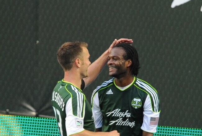 PORTLAND, OR - JUNE 19: Jorge Perlaza #15 and Jack Jewsbury #13 of the Portland Timbers celebrate after a ball that Perlaza kicked into the box was then kicked in to the goal by a Red Bull player for an own goal during the second half of the game at Jeld-Wen Field on June 19, 2011 in Portland, Oregon.The game ended in a 3-3 draw. (Photo by Steve Dykes/Getty Images)