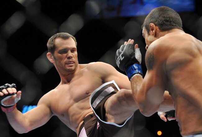 DALLAS - SEPTEMBER 19:  UFC fighter Vitor Belfort (R) battles UFC fighter Rich Franklin (L) during their Catch weight bout at UFC 103: Franklin vs. Belfort at the American Airlines Center on September 19, 2009 in Dallas, Texas.  (Photo by Jon Kopaloff/Getty Images)