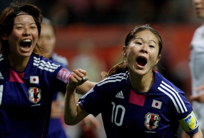 FRANKFURT AM MAIN, GERMANY - JULY 17:  Homare Sawa (R) of Japan celebrates after scoring her team's second goal with Saki Kumagai (L) during the FIFA Women's World Cup Final match between Japan and USA at the FIFA World Cup stadium Frankfurt on July 17, 2011 in Frankfurt am Main, Germany.  (Photo by Friedemann Vogel/Getty Images)