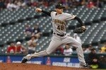CLEVELAND, OH - JUNE 19:   Tim Wood #48 of the Pittsburgh Pirates pitches against the Cleveland Indians during their game on June 19, 2011 at Progressive Field in Cleveland, Ohio.  The Indians defeated the Pirates 5-2 in 11 innings.  (Photo by David Maxwell/Getty Images)