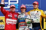 BUDAPEST, HUNGARY - AUGUST 05:  (L-R) Adam Carroll of Great Britain (2nd), Javier Villa of Spain (1st) and Roldan Rodriguez of Spain (3rd) pose on the podium in the 2007 GP2 Series prior to the Hungarian Formula One Grand Prix at the Hungaroring on August 5, 2007, in Budapest, Hungary.  (Photo by Mark Thompson/Getty Images)