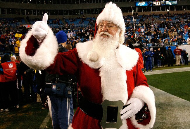 CHARLOTTE, NC - DECEMBER 20:  Santa Claus walks onto the field before the game against the Minnesota Vikings and the Carolina Panthers at Bank of America Stadium on December 20, 2009 in Charlotte, North Carolina.  (Photo by Kevin C. Cox/Getty Images)