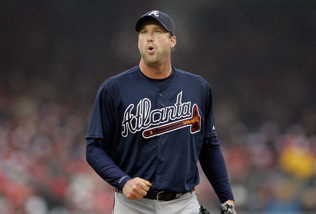 WASHINGTON, DC - MARCH 31:  Starting pitcher Derek Lowe #32 of the Atlanta Braves reacts during the game against the Washington Nationals during the third inning on opening day at Nationals Park on March 31, 2011 in Washington, DC.  (Photo by Rob Carr/Getty Images)