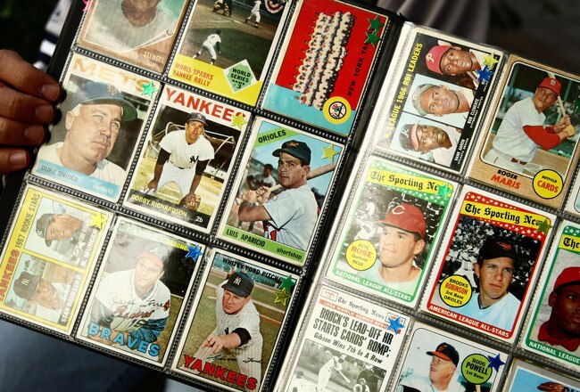 NEW YORK - SEPTEMBER 21: A man sells vintage baseball cards prior to the start of the last game at Yankee Stadium between the Baltimore Orioles and the New York Yankees on September 21, 2008 at Yankee Stadium in the Bronx borough of New York City. Yankee Stadium held it's inaugural game on April 18, 1923 against the Boston Red Sox and tonight's match will be the final game to be played at the historic stadium. During it's 85 years as ''The Home of Champions,'' the stadium has also been known as ''The House that Ruth Built'' and ''The Cathedral.'' The stadium has been host to 33 World Series, three Papal visits and has been visited by legends such as Babe Ruth, Joe DiMaggio, Yogi Bera, Mickey Mantle and boxing great Muhummad Ali. In 2009 the Yankees will move across the street to a newly constructed stadium estimated to cost $1.3 billion. (Photo by Chris McGrath/Getty Images)
