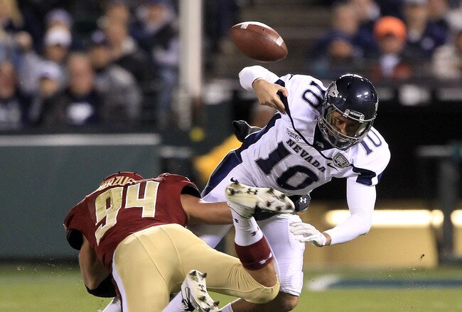 SAN FRANCISCO, CA - JANUARY 09:  Colin Kaepernick #10 of the Nevada Wolf Pack fumbles the ball after being hit by Mark Herzlich #94 of the Boston College during the Kraft Fight Hunger Bowl at AT&T Park on January 9, 2011 in San Francisco, California.  (Photo by Ezra Shaw/Getty Images)