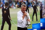 SANDWICH, ENGLAND - JULY 18:  Darren Clarke of Northern Ireland poses with the Claret Jug next to the Seve Ballesteros posters on the 18th green following his victory in The 140th Open Championship at Royal St George's on July 18, 2011 in Sandwich, England.  (Photo by Streeter Lecka/Getty Images)