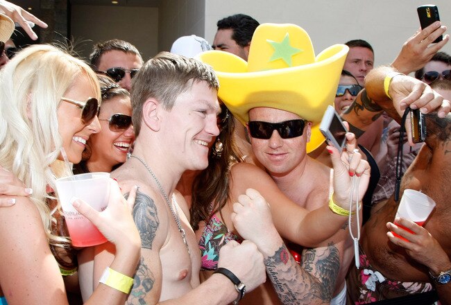 LAS VEGAS - MAY 03:  Boxer Ricky Hatton (C) of England poses with fans as he hosts an event at the Wet Republic pool at the MGM Grand Hotel/Casino May 3, 2009 in Las Vegas, Nevada. Hatton was knocked out in the second round by Manny Pacquiao of the Philippines in their junior welterweight title fight on May 2.  (Photo by Ethan Miller/Getty Images)