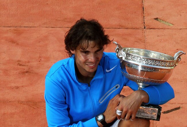 PARIS, FRANCE - JUNE 05:  Champion Rafael Nadal of Spain poses with the trophy following his victory during the men's singles final match between Rafael Nadal of Spain and Roger Federer of Switzerland on day fifteen of the French Open at Roland Garros on June 5, 2011 in Paris, France.  (Photo by Alex Livesey/Getty Images)