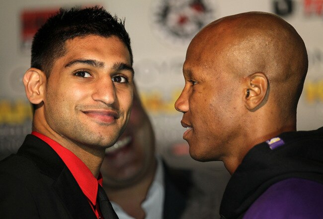 LOS ANGELES, CA - JUNE 08:  Amir Khan (L) and Zab Judah face off at a press conference to discuss their upcoming Super Lightweight World Championship Unification Fight at ESPN Zone At L.A. Live on June 8, 2011 in Los Angeles, California.  (Photo by Stephen Dunn/Getty Images)