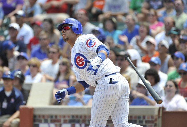 CHICAGO, IL - JULY 17:  Aramis Ramirez #16 of the Chicago Cubs hits an RBI double scoring Starlin Castro during the first inning against the Florida Marlins at Wrigley Field on July 17, 2011 in Chicago, Illinois.  (Photo by Brian Kersey/Getty Images)