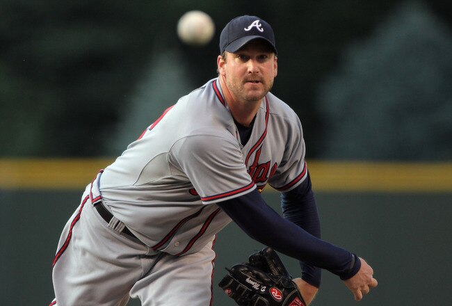 DENVER, CO - JULY 18:  Starting pitcher Derek Lowe #32 of the Atlanta Braves delivers against the Colorado Rockies at Coors Field on July 18, 2011 in Denver, Colorado.  (Photo by Doug Pensinger/Getty Images)