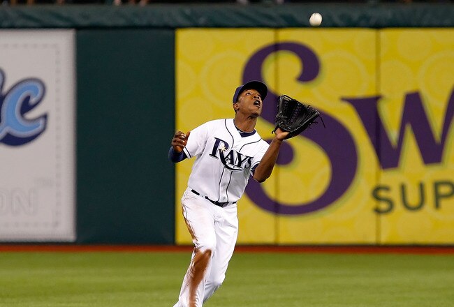 ST. PETERSBURG, FL - JULY 16:  Outfielder B.J. Upton #2 of the Tampa Bay Rays catches a fly ball against the Boston Red Sox during the game at Tropicana Field on July 16, 2011 in St. Petersburg, Florida.  (Photo by J. Meric/Getty Images)