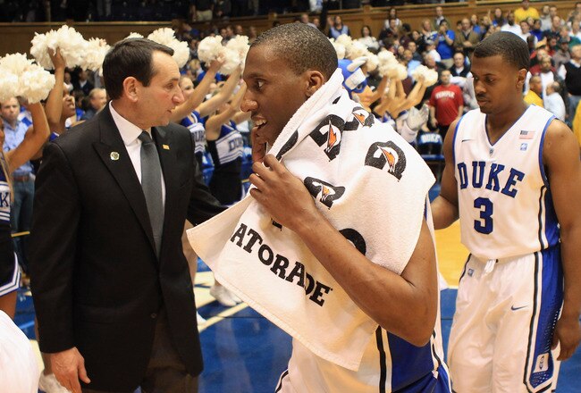 DURHAM, NC - FEBRUARY 23:  Head coach Mike Krzyzewski congratulates players Nolan Smith #2 and Tyler Thornton #3 of the Duke Blue Devils after their 78-61 victory over the Temple Owls at Cameron Indoor Stadium on February 23, 2011 in Durham, North Carolina.  (Photo by Streeter Lecka/Getty Images)