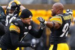 PITTSBURGH - DECEMBER 12:  Ben Roethlisberger #7 and James Harrison #92 of the Pittsburgh Steelers go through their pregame ritual prior to the game against the Cincinnati Bengals on December 12, 2010 at Heinz Field in Pittsburgh, Pennsylvania.  (Photo by Jared Wickerham/Getty Images)