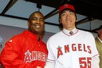 ANAHEIM, CA - DECEMBER 16:  (L-R) Los Angeles Angels of Anaheim general manager Tony Reagins and Hideki Matsui shake hands as manager Mike Scioscia looks on during a press conference at Angel Stadium of Anaheim on December 16, 2009 in Anaheim, California.  (Photo by Jeff Gross/Getty Images)