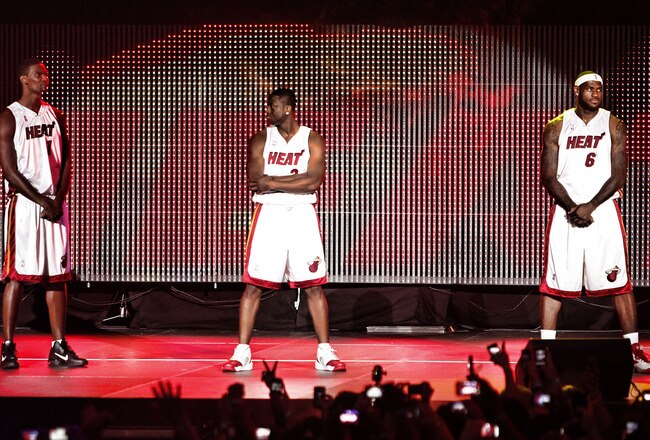 MIAMI - JULY 09:  Fans cheer as (L-R) Chris Bosh #1, Dwyane Wade #3, and LeBron James #6 of the Miami Heat are introduced during a welcome party at American Airlines Arena on July 9, 2010 in Miami, Florida.  (Photo by Marc Serota/Getty Images)
