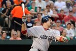 BALTIMORE, MD - JULY 19: Adrian Gonzalez #28 of the Boston Red Sox strikes out swing for the second out of the fourth inning against the Baltimore Orioles at Oriole Park at Camden Yards on July 19, 2011 in Baltimore, Maryland.  (Photo by Rob Carr/Getty Images)
