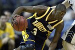 MINNEAPOLIS - MARCH 27:  Dwyane Wade #3 of the Marquette University Golden Eagles drives around Donatas Zavackas #5 of the University of Pittsburgh Panthers during the Midwest Regional of the NCAA Men's Basketball Championship at the Hubert H. Humphrey Metrodome on March 27, 2003 in Minneapolis, Minnesota.  The Golden Eagles won 77-74.  (Photo by Elsa/Getty Images)