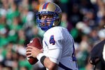 SOUTH BEND, IN - OCTOBER 30: G.J. Kinne #4 of the Tulsa Golden Hurricane looks to pass as Darius Flemming #45 of the Notre Dame Fighting Irish rushes at Notre Dame Stadium on October 30, 2010 in South Bend, Indiana. Tulsa defeated Notre Dame 28-27. (Photo by Jonathan Daniel/Getty Images)