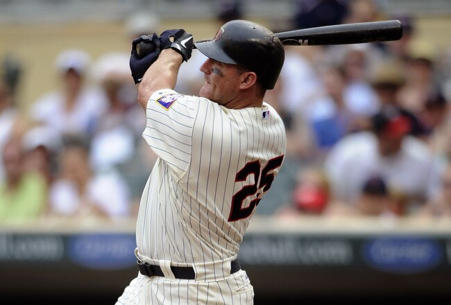 MINNEAPOLIS, MN - JULY 17: Jim Thome #25 of the Minnesota Twins hits a three-run home run against the Kansas City Royals in the sixth inning on July 17, 2011 at Target Field in Minneapolis, Minnesota. (Photo by Hannah Foslien/Getty Images)