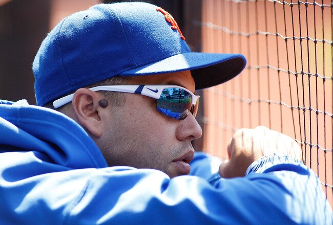 NEW YORK, NY - JULY 17:  Carlos Beltran #15 of the New York Mets looks on from the bench during the game against the Philadelphia Phillies on July 17, 2011 at Citi Field in the Flushing neighborhood of the Queens borough of New York City.  (Photo by Mike Stobe/Getty Images)