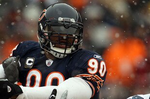 CHICAGO, IL - JANUARY 16:  Julius Peppers #90 of the Chicago Bears is blocked by Chris Spencer #65 of the Seattle Seahawks in the 2011 NFC divisional playoff game at Soldier Field on January 16, 2011 in Chicago, Illinois.  (Photo by Jonathan Daniel/Getty Images)
