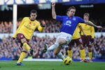 LIVERPOOL, ENGLAND - NOVEMBER 14:  Cesc Fabregas of Arsenal (L) shoots past Phil Jagielka of Everton to score the 2-0 goal during the Barclays Premier League match between Everton and Arsenal at Goodison Park on November 14, 2010 in Liverpool, England.  (Photo by Shaun Botterill/Getty Images)