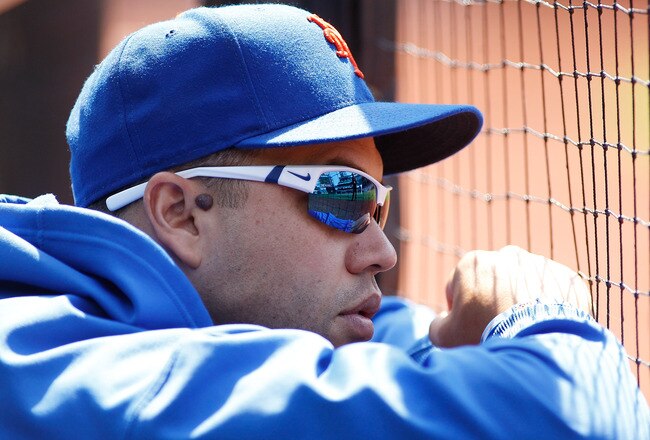 NEW YORK, NY - JULY 17:  Carlos Beltran #15 of the New York Mets looks on from the bench during the game against the Philadelphia Phillies on July 17, 2011 at Citi Field in the Flushing neighborhood of the Queens borough of New York City.  (Photo by Mike Stobe/Getty Images)